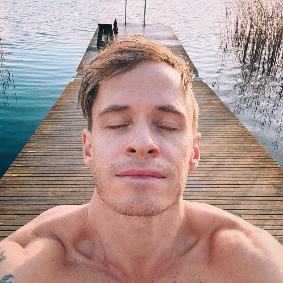 Mattias on a dock in the sun