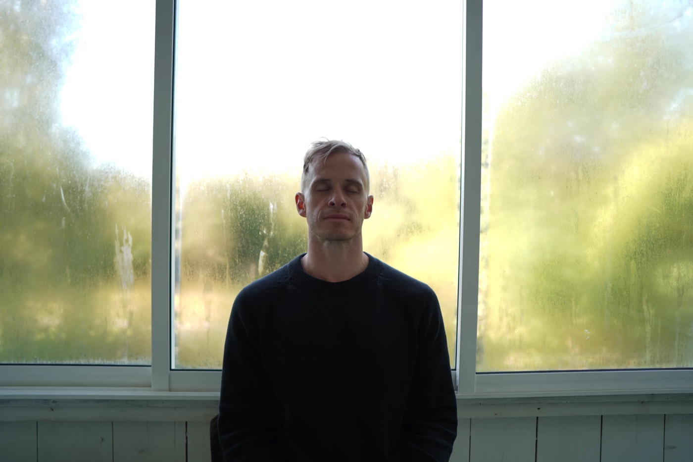 Mattias by a misty window
